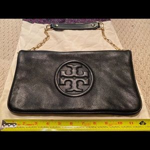 Tory Burch black leather clutch with gold chain.
